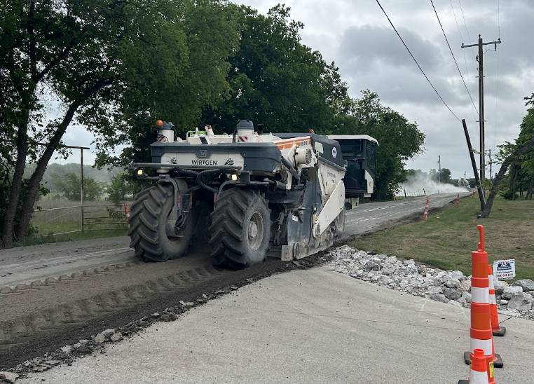 Wirtgen soil stabilizer working on a rural road construction project in Sunnyvale TX by Gentry's Paving Group.